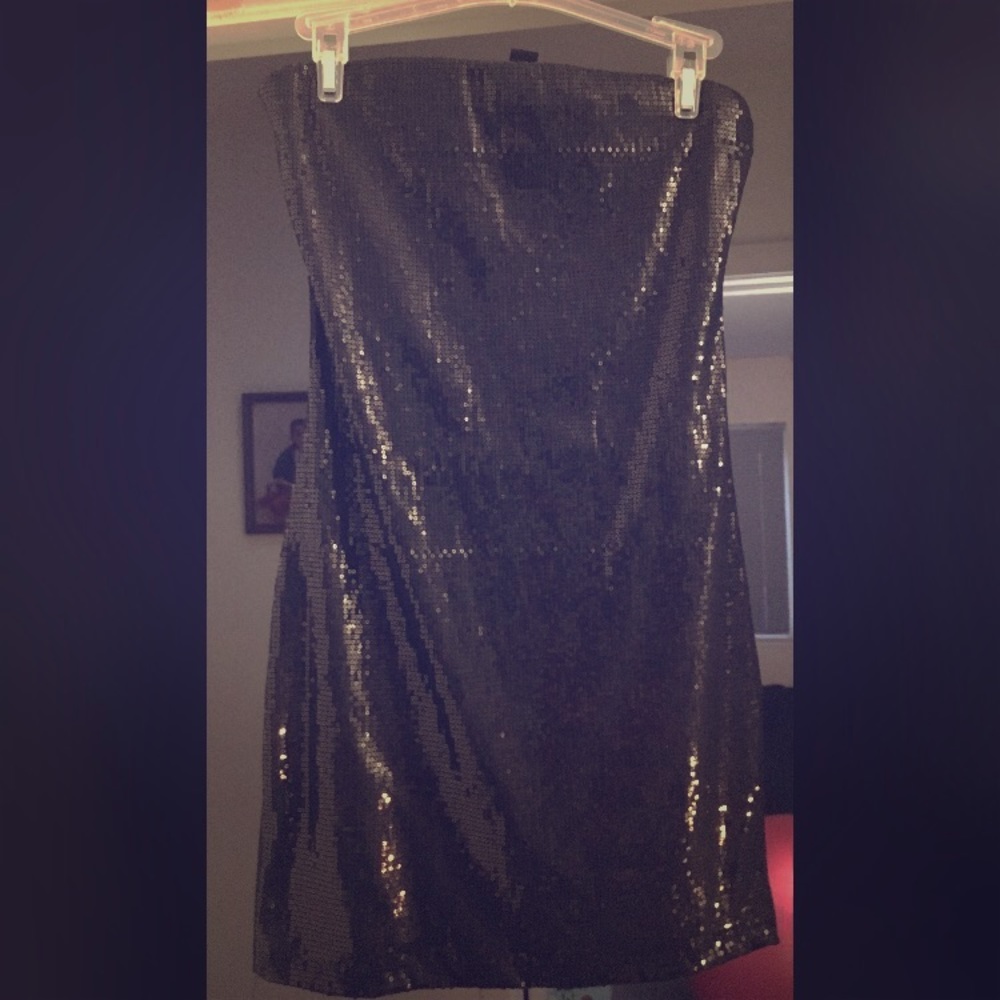 Black strapless black cocktail or clubbing dress.